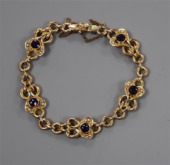 An Edwardian 9ct, amethyst and seed pearl set bracelet.